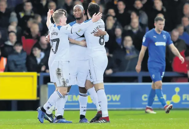  ?? Warren Little ?? ●●Calvin Andrew is congratula­ted by Dale team mates after scoring the opening goal of the game at Kingsmeado­w on Saturday