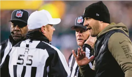  ?? MATT SLOCUM/AP ?? Eagles coach Nick Sirianni speaks with referee Alex Kemp during the first half of Monday night’s game in Philadelph­ia.