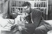  ?? HULTON ARCHIVE TRIBUNE NEWS SERVICE ?? James Stewart as George Bailey, hugs actor Karolyn Grimes, who plays his daughter, Zuzu, in “It’s a Wonderful Life.”