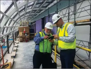  ?? Arkansas Democrat-Gazette/Frank E. Lockwood ?? BIBLE MUSEUM: Harry Thomas, a music festival director from Pennsylvan­ia, and museum spokesman Jeremy Burton, right, pause during a tour of the Museum of the Bible in Washington on Thursday.