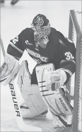  ?? David Silverman ?? Flames’ draft choice Jon Gillies is refining his game in net with the Providence Friars.