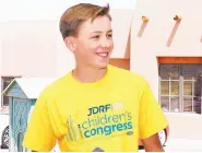  ?? COURTESY OF JDRF ?? New Mexico JDRF Children’s Congress delegate Evan Clark speaks at the New Mexico JDRF Golf Tournament earlier this year.
