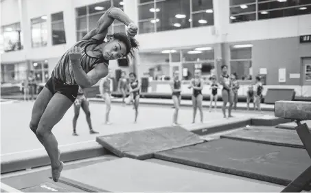  ?? Marie D. De Jesús / Staff photograph­er ?? Simone Biles has an attentive audience as she practices on a balance beam Friday.