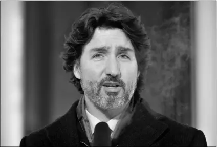  ?? Adrian Wyld/The Canadian Press via AP ?? Canadian Prime Minister Justin Trudeau speaks during a news conference outside Rideau cottage in Ottawa, Ontario, on Tuesday.