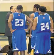  ?? SUBMITTED PHOTO ?? Beltway Bombers coach and team owner Chaz Dudley confers with his players during a timeout earlier this season. On Saturday night Dudley guided his team to a 123-105 victory over APBL United to capture the American Profession­al Basketball League...