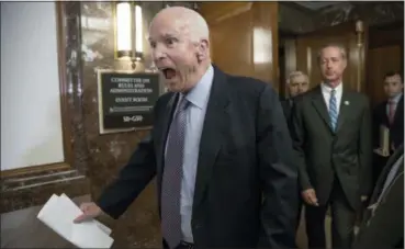  ?? J. SCOTT APPLEWHITE — THE ASSOCIATED PRESS FILE ?? Sen. John McCain, R-Ariz., followed at right by House Armed Services Chairman Mac Thornberry, R-Texas, makes a humorous face to reporters in October 2017. McCain’s “wicked” wit was often aimed at himself over long Washington career.