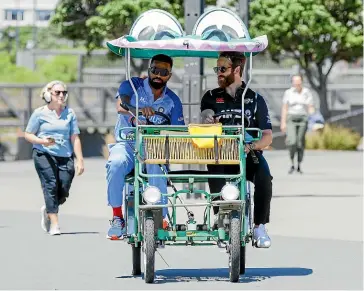  ?? GETTY IMAGES ?? Indian T20 skipper Hardik Pandy, left, and Black Caps captain Kane Williamson share a trip around the Wellington waterfront yesterday.