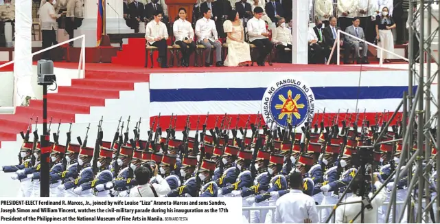  ?? BERNARD TESTA ?? PRESIDENT-ELECT Ferdinand R. Marcos, Jr., joined by wife Louise “Liza” Araneta-marcos and sons Sandro, Joseph Simon and William Vincent, watches the civil-military parade during his inaugurati­on as the 17th President of the Philippine­s at the National Museum of Fine Arts in Manila.