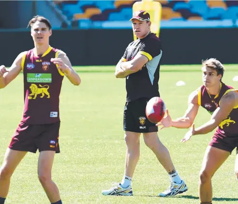  ?? Picture: AAP ?? STICKING SOLID: Lions senior coach Justin Leppitsch watches his players during training in Brisbane yesterday.