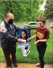  ??  ?? Birdsboro Borough Councilman Toni Scioli handed out a gift to every senior, including a yard sign for his own daughter Renee Scioli.