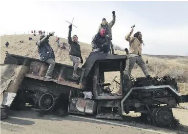  ?? JAMES MACPHERSON / THE ASSOCIATED PRESS FILES ?? Protests this week near Cannon Ball, N.D., against the 1,930-kilometre Dakota Access oil pipeline, which would carry oil across four states to a shipping point in Illinois.