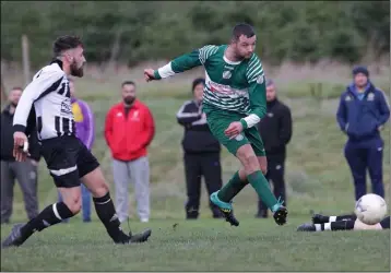  ??  ?? Luke Lacey of Ballymurn Celtic is chased by Seán O’Shea of Ajax Athletic during their Wexford Football Division 3A match on Sunday.