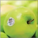  ?? SUBMITTED PHOTO — GIANT FOOD STORES ?? Green apples are on display at the grocery store with an organic seal.