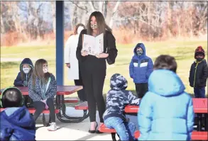  ?? Brian A. Pounds / Hearst Connecticu­t Media ?? Shelton Director of Curriculum Kristen Santilli reads to students in Tracey Sedlock’s first-grade class in the outdoor classroom at Mohegan School in Shelton on Jan. 19.