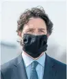  ?? FRANK GUNN THE CANADIAN PRESS ?? Prime Minister Justin Trudeau wears a mask at a repatriati­on ceremony at CFB Trenton for Armed Forces members killed in a helicopter crash.