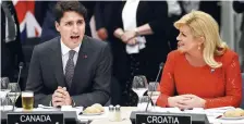  ??  ?? Le premier ministre Justin Trudeau et la président croate, Kalinda Grabar-Kitarovic, jeudi, à Bruxelles. − Associated Press: Matt Dunham
