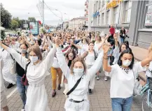  ?? VASILY FEDOSENKO • REUTERS ?? Women take part in a demonstrat­ion against police violence during the recent rallies of opposition supporters following the presidenti­al election in Minsk, Belarus on Aug. 12. It’s alleged that police fired at protestors, injuring one person.