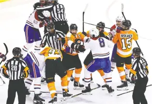  ?? ELSA/GETTY IMAGES) ?? The Canadiens and Flyers mix it up late in the third period during Game 5 of their first-round series. Game 6 goes Friday and both sides expect it to be a physical affair.