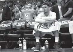  ?? Associated Press ?? ■ Golden State Warriors guard Klay Thompson (11) sits on the bench during the second half in Game 2 of the NBA basketball Western Conference Finals against the Houston Rockets on Wednesday in Houston.