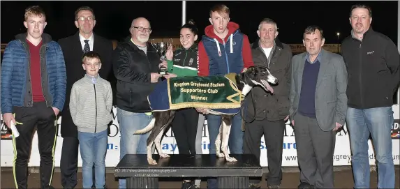  ??  ?? Murt Murphy, KGSSC chairman, presents the winner’s trophy to Julianne O’Keeffe after Darragh Jet won the K.G.S.S.C. A3 Stake final at the Kingdom Stadium on Friday night. Included, from left, are Conor and Gavin O’Keeffe, Declan Dowling (KGS Manager), Darragh Sheehan, John Kelliher, joint-owner Johnny O’Keeffe and Kieran Casey (Racing Manager). Photo by www.deniswalsh­photograph­y.com