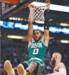  ?? Picture: AFP ?? HANG TIME: Boston’s Jayson Tatum slams one home.