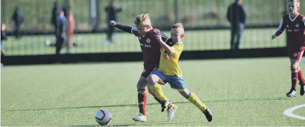  ??  ?? Action from Russell Foster under-10s football between Durham City Juniors (yellow) and Silksworth CW Reds at Silksworth Sports Complex, Sunderland.