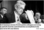  ?? PHOTO: REUTERS ?? Fed Chairman Jerome Powell and his colleagues are trying to pull off a feat the central bank has accomplish­ed only once in its 104-year history