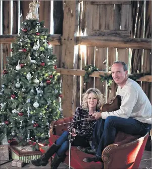  ?? SUBMITTED PHOTO ?? Fiddling superstars Natalie MacMaster and Donnell Leahy tune their fiddles around the Christmas tree in preparatio­n for this Friday’s concert at Centre 200.