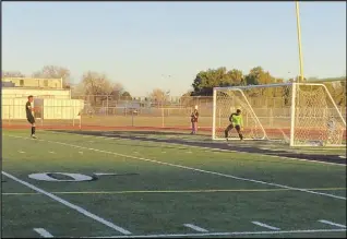  ?? ALAN HENDRY/Valley Press ?? MAKING IT COUNT — Palmdale’s Brian Trujillo, left, celebrates his goal on a penalty kick, while Quartz Hill goalkeeper Divontae Williams, right, watches it go by during Thursday’s Golden League game. The Falcons made the goal stand and walked away with a 1-0 victory and the Golden League title.