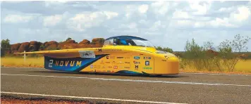  ??  ?? ... University of Michigan Solar Car Team vehicle ‘Novum’ from the United States speeding past the Devil’s Marbles near Tennant Creek on the second day of the World Solar Challenge yesterday. The epic 3,000km solar car race across outback Australia has...