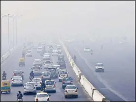  ?? EPA ?? Morning traffic moves on the roads engulfed in smog in New Delhi, India yesterday.