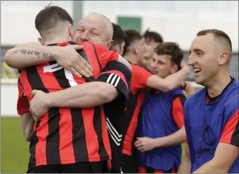  ??  ?? Gorey Rangers manager Shane Dunbar hugs Killian Cushe.