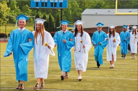  ?? JESI YOST — FOR DIGITAL FIRST MEDIA ?? The Daniel Boone High School class of 2018 enters the stadium Friday evening for the start of commenceme­nt exercises.