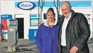  ?? Picture: Sara Bain ?? Uig Community Trust chairwoman Seonag Henderson with husband Ian outside the village’s filling station, where one of the new generators will be installed.