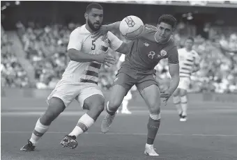  ?? BRIAN LAWLESS/PA VIA AP ?? The United States’ Cameron Carter-Vickers, left, and Republic of Ireland’s Callum O’Dowda battle for the ball during the internatio­nal friendly match at the Aviva Stadium in Dublin, Ireland, on Saturday.