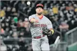  ?? Justin Berl Getty Images ?? ZACK COZART, a shortstop with Cincinnati, is moving to third base with the Angels.