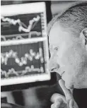  ?? Michael Nagle / Bloomberg ?? A trader works on the floor of the New York Stock Exchange on Friday. Stocks advanced again to record highs.