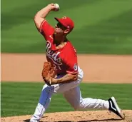  ?? AP PHOTO/AARON DOSTER ?? The Cincinnati Reds’ Michael Lorenzen pitches against the visiting Detroit Tigers on Sunday at Great American Ballpark. The Tigers won 3-2.