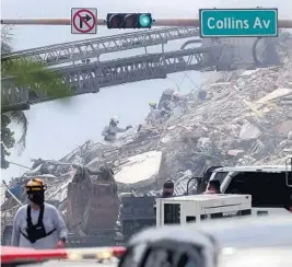  ?? AMY BETH BENNETT/SOUTH FLORIDA SUN SENTINEL ?? Rescue workers dig through rubble at the 12-story oceanfront Champlain Towers South Condo in Surfside on Friday.