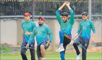  ?? PTI ?? ▪ Afghanista­n players during the team’s practice session on the eve of their oneoff Test against India in Bangalore.