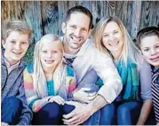  ?? KNIGHT FAMILY / CONTRIBUTE­D ?? Elijah Knight, 14, shown with his family, was a tinkerer and alto saxophonis­t killed by a tree in a storm at a Boy Scouts camp in Covington. Elijah was on his way to becoming an Eagle Scout, like his dad.