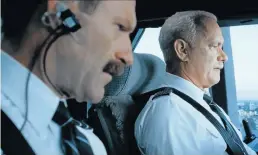  ??  ?? WE HAVE A PROBLEM: Aaron Eckhart, left, plays co-pilot Jeff Skiles and Tom Hanks plays captain Chesley ‘Sully’ Sullenberg­er in the true-life story of heroic action in saving all 155 passengers and crew aboard US Airways flight 1549 by landing on the...