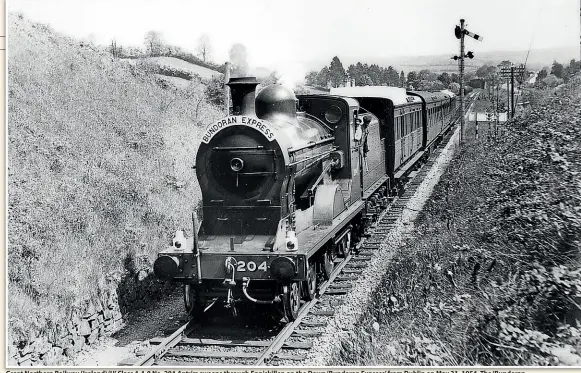  ?? NEIL SPRINKS/CHARLES P FRIEL COLLECTION ?? Great Northern Railway (Ireland) ‘U’ Class 4-4-0 No. 204 Antrim sweeps through Enniskille­n on the Down ‘Bundoran Express’ from Dublin on May 31, 1954. The ‘Bundoran Express’ ran non-stop through Northern Ireland to avoid the need for customs examinatio­ns.