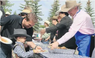  ?? FILES ?? Prime Minister Stephen Harper serves pancakes at a breakfast in Calgary in July 2011.