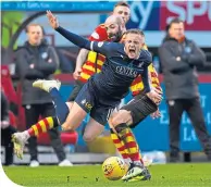  ??  ?? Falkirk’s Maclean is brought down by Harkins, who was sent off for a similar foul later in the game