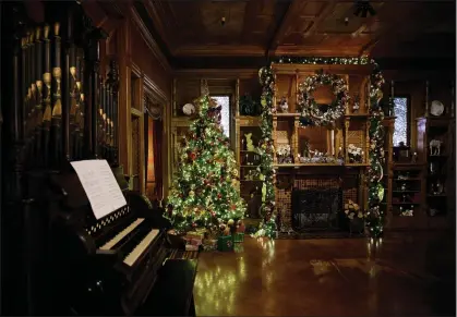  ?? PHOTOS BY DAI SUGANO — STAFF PHOTOGRAPH­ER ?? The Grand Ballroom in the Winchester Mystery House in San Jose is decorated for the holidays Thursday. Today, Friday the 13th, the mansion will stage an evening flashlight tour — and maybe the Ghost of Christmas Past will spook visitors.