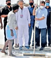  ??  ?? Rahul Gandhi scrapping salt in a pan at Kovankadu in Thoothukud­i on Saturday