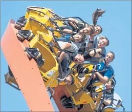  ?? DAI SUGANO — STAFF PHOTOGRAPH­ER ?? Amusement park visitors react as they ride RailBlazer, a new roller coaster at California’s Great America, on Wednesday.