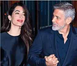  ??  ?? Holding hands: George and Amal Clooney on Sunday