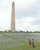  ?? CHIP SOMODEVILL­A/GETTY IMAGES ?? A National Mall art installati­on last fall by Suzanne Brennan Firstenber­g commemorat­es the Americans who have died from COVID-19.